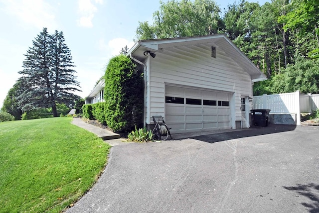 garage with a yard