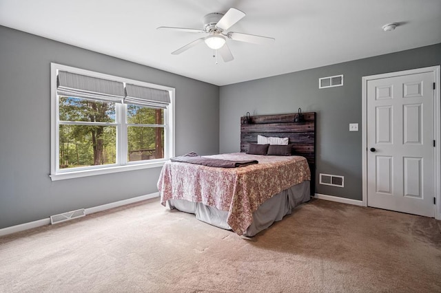 bedroom with ceiling fan and carpet