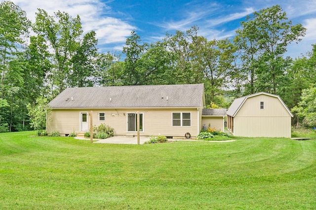 back of property with a yard and a patio