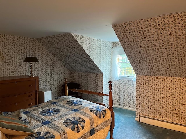 bedroom featuring dark colored carpet, lofted ceiling, and baseboard heating