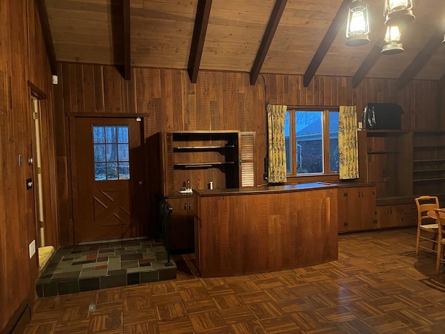 kitchen featuring wood ceiling, wooden walls, dark parquet flooring, lofted ceiling with beams, and kitchen peninsula