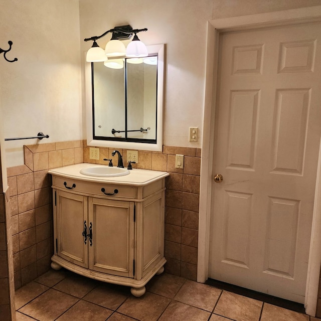 bathroom featuring tile patterned floors, vanity, and tile walls