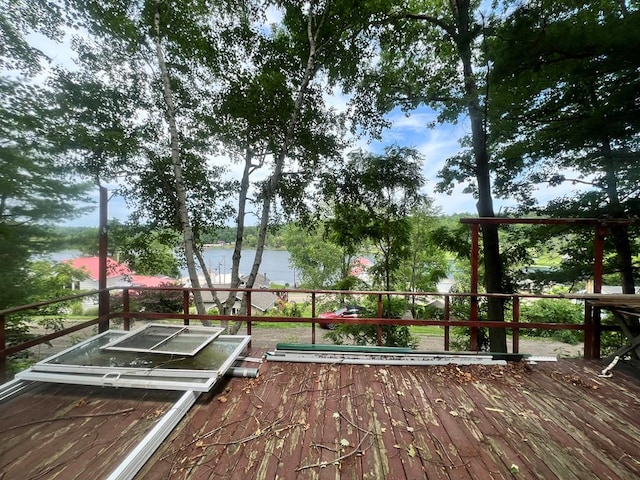 wooden deck with a water view