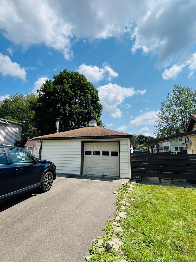 garage featuring a yard