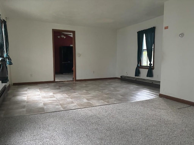 spare room featuring a baseboard radiator