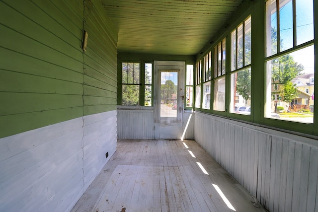 unfurnished sunroom featuring plenty of natural light