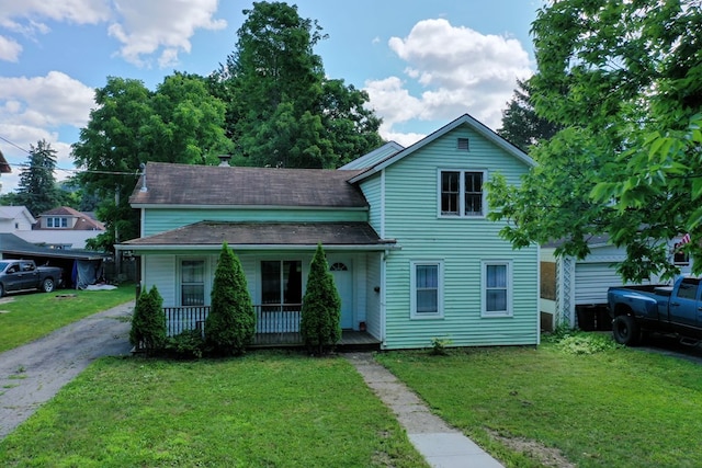 view of front of home featuring a front yard and covered porch