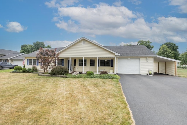 ranch-style house featuring a carport, a porch, a garage, and a front lawn