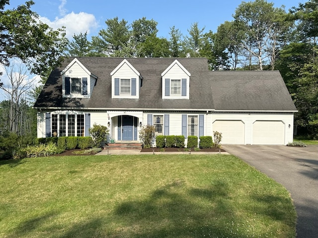 cape cod-style house featuring a front yard