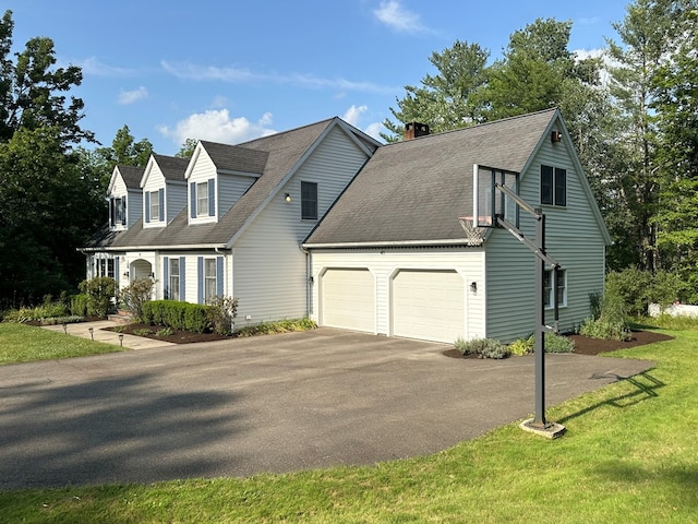 cape cod home with a garage