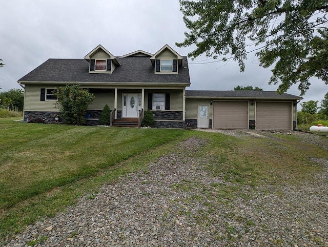 view of front of property with a garage and a front yard