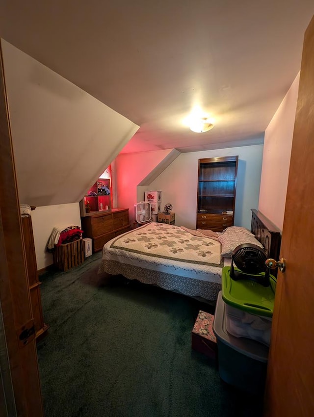 bedroom featuring carpet flooring and vaulted ceiling