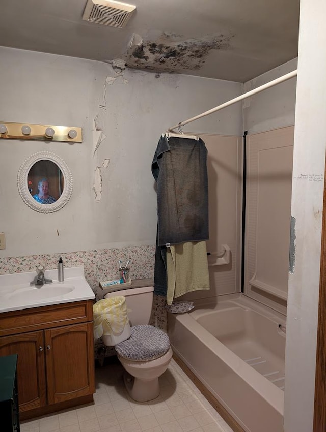 full bathroom with shower / bathing tub combination, vanity, and toilet