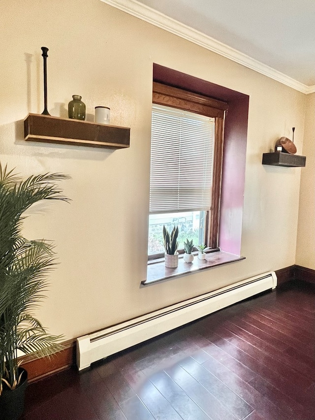 interior space with ornamental molding, a baseboard heating unit, and dark hardwood / wood-style flooring