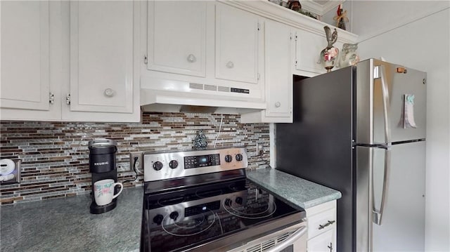 kitchen with decorative backsplash, stainless steel appliances, and white cabinets