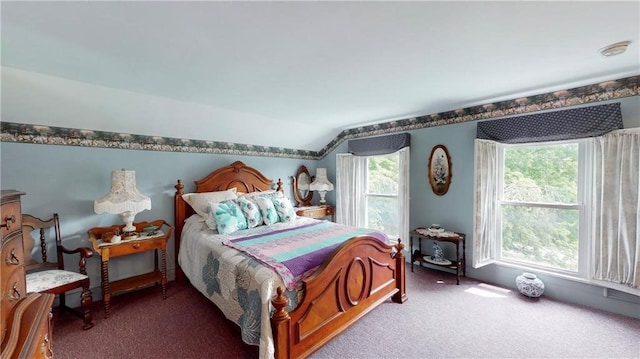 carpeted bedroom with vaulted ceiling