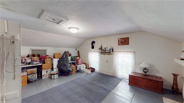 additional living space featuring vaulted ceiling