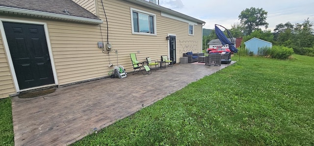 view of yard with an outdoor living space and a patio