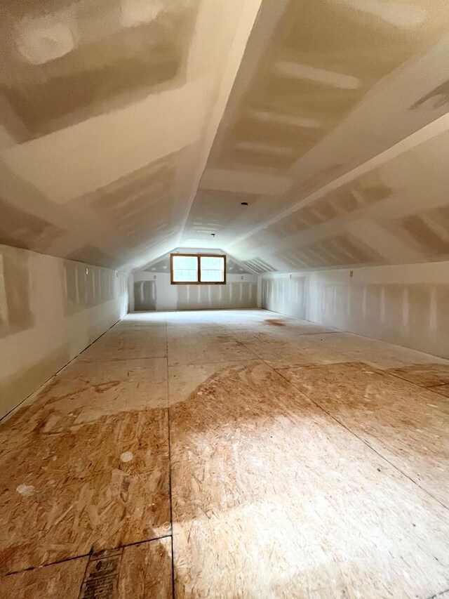 additional living space with vaulted ceiling