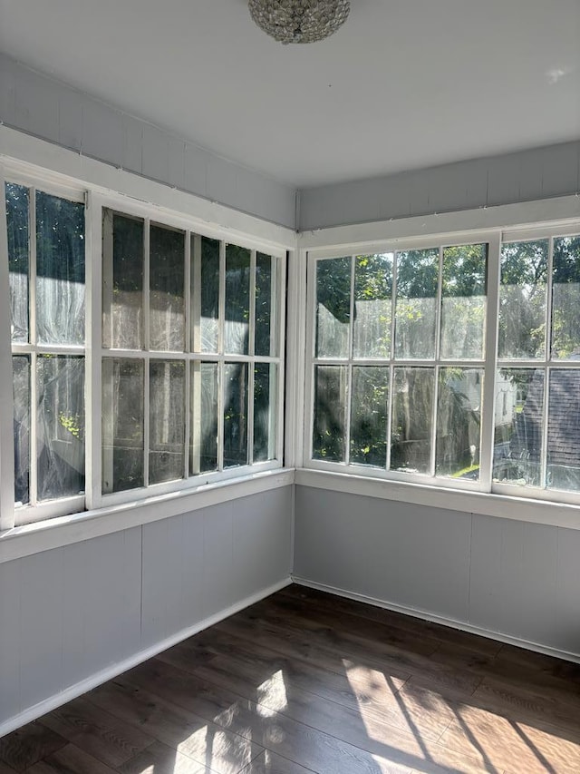 unfurnished sunroom featuring a wealth of natural light