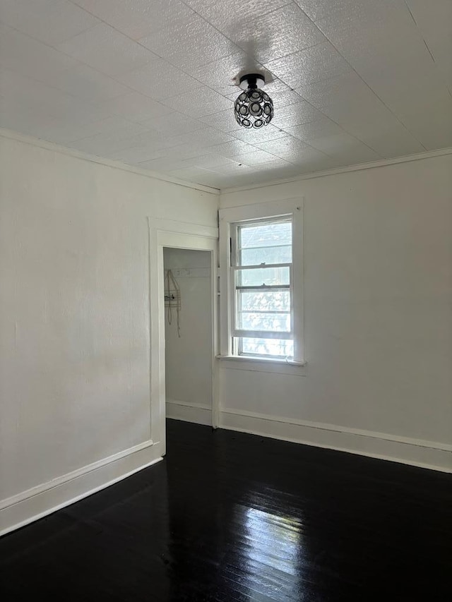 unfurnished room featuring dark hardwood / wood-style floors