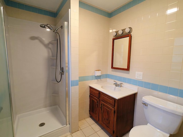 bathroom with tile walls, an enclosed shower, and tile patterned floors