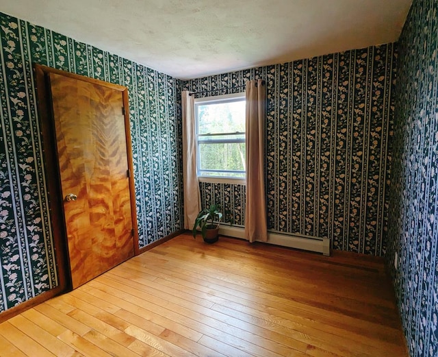 unfurnished room featuring wood-type flooring