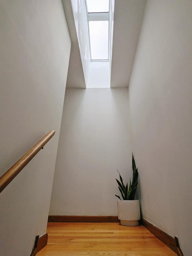 staircase featuring hardwood / wood-style floors