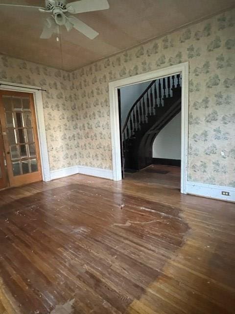 interior space with ceiling fan and dark wood-type flooring