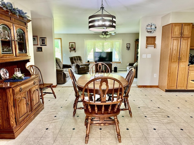 dining room with a wealth of natural light and ceiling fan with notable chandelier