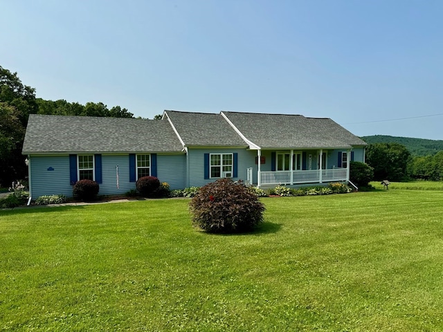 ranch-style home with a porch and a front yard