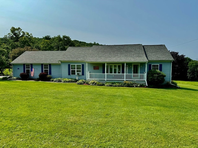 ranch-style home featuring a front yard and a porch