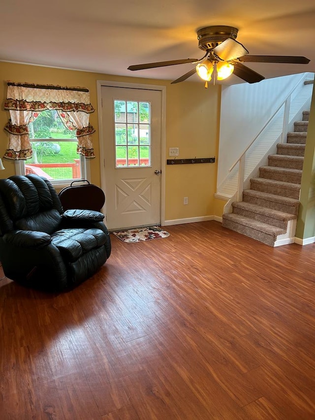 interior space with wood-type flooring and ceiling fan