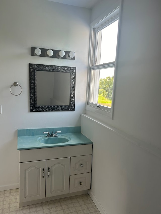 bathroom with vanity and a wealth of natural light