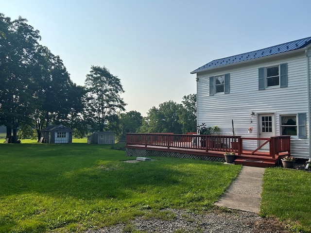 view of yard with a storage unit and a deck