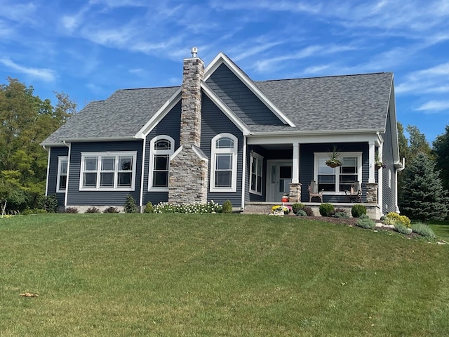 craftsman house with a porch and a front yard