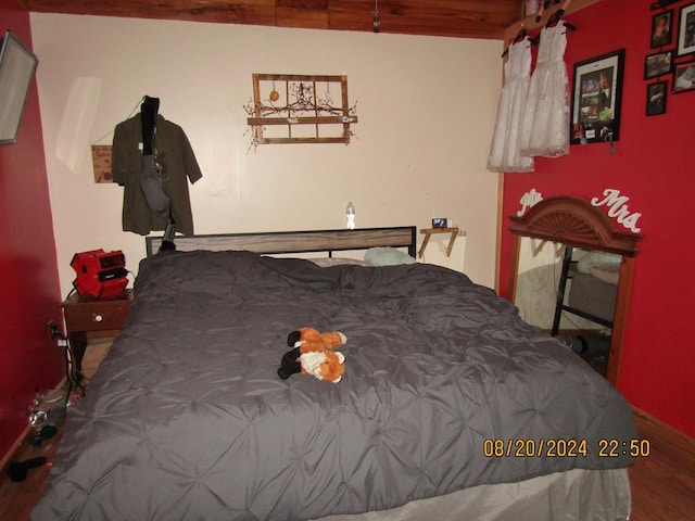 bedroom featuring wood-type flooring