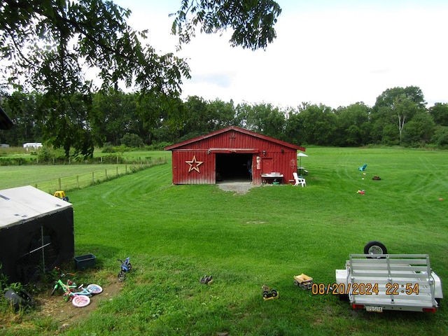 view of outdoor structure featuring a lawn