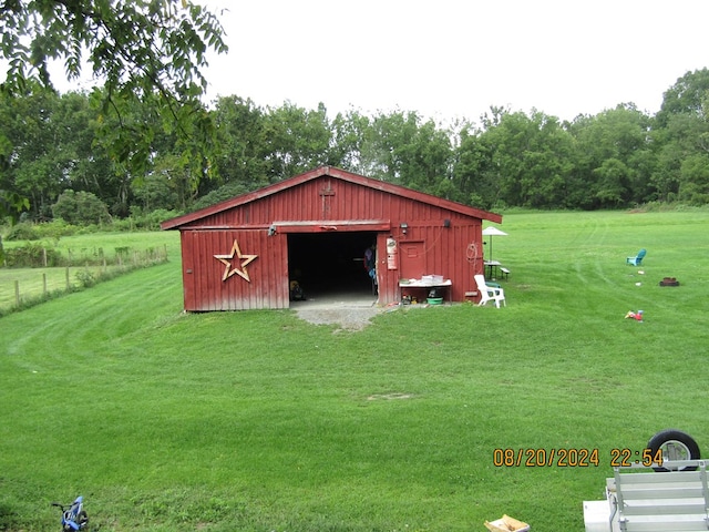 view of outdoor structure with a lawn