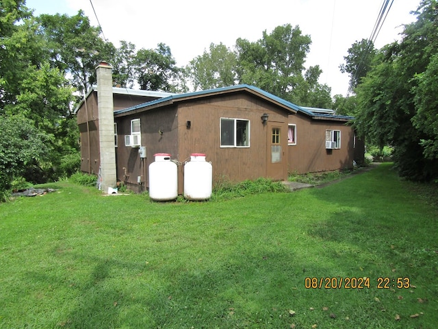 view of property exterior featuring a yard