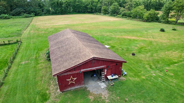 birds eye view of property with a rural view