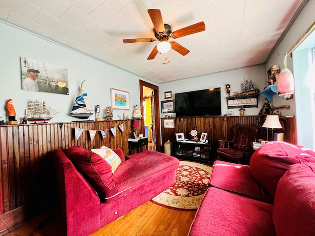 living room with ceiling fan and hardwood / wood-style floors