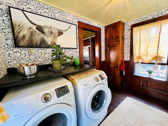 washroom with independent washer and dryer and dark wood-type flooring