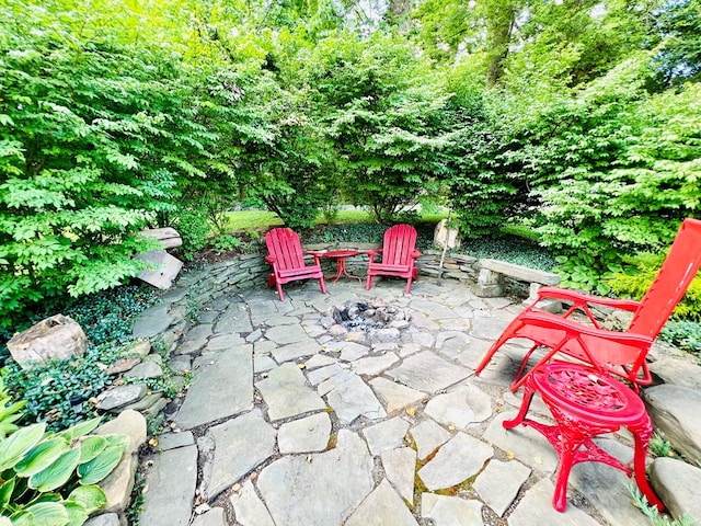 view of patio featuring a fire pit