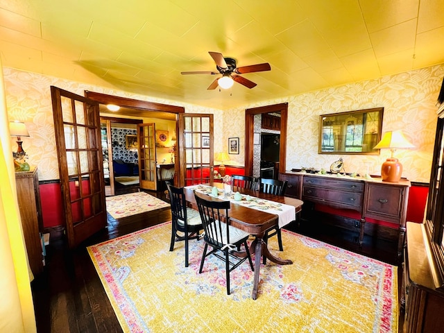 dining area featuring ceiling fan and dark wood-type flooring