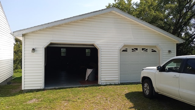 garage with a lawn