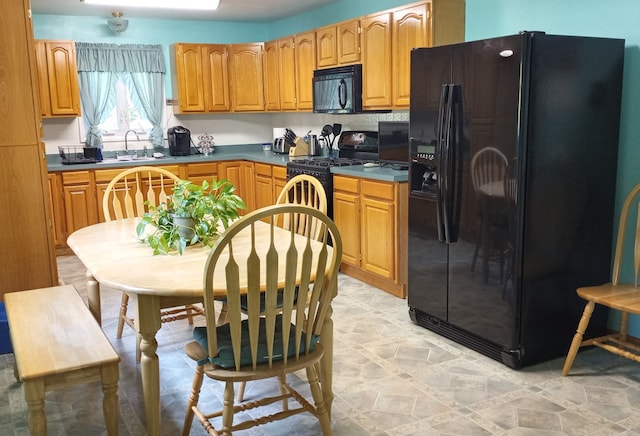 kitchen featuring black appliances and sink