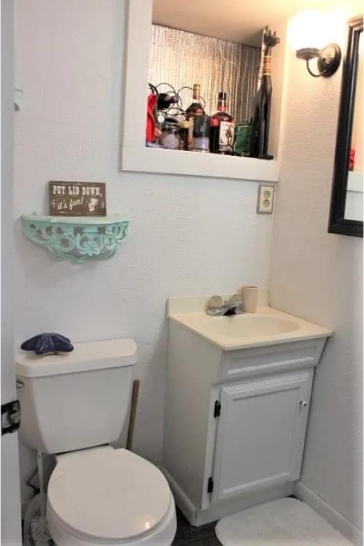 bathroom featuring vanity and toilet