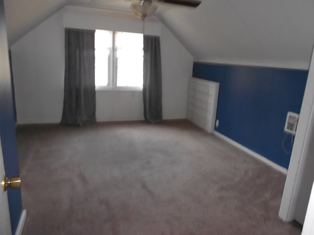 bonus room with ceiling fan, carpet, and vaulted ceiling