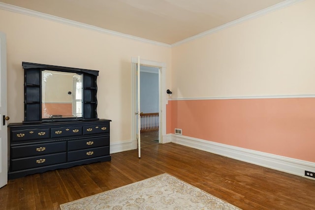 bedroom with dark wood-type flooring and ornamental molding